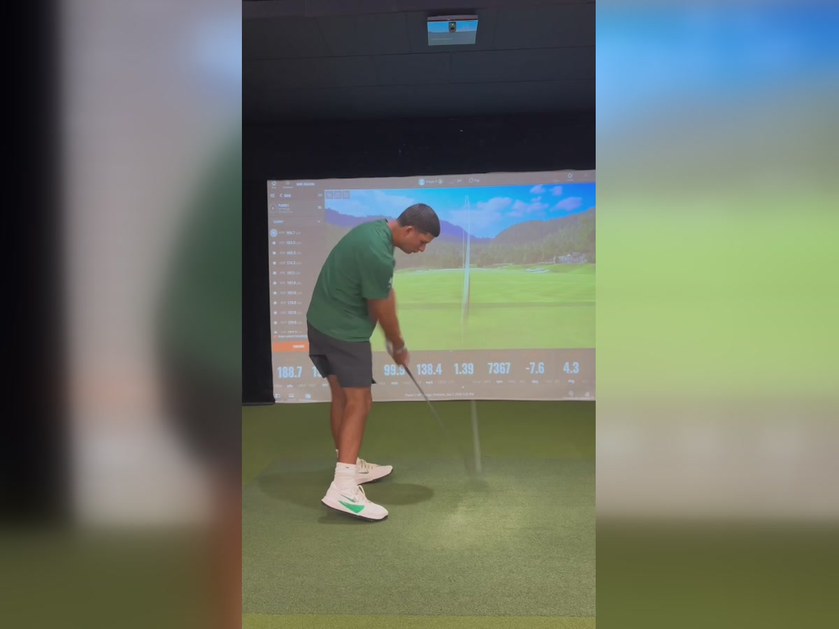 Cameron testing a Ferro iron in the TrackMan bay at Clubhouse Hawaii